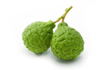 Kaffir lime on white ground.