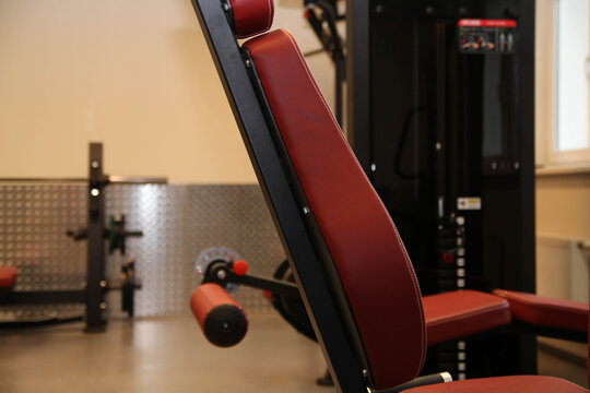 The background of the gym. Free weight training. Functional powerful training.  Modern gym fitness center. Red. Sport industry.