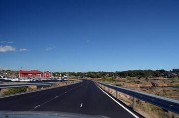 A typical Norwegian road in the countryside.  Ostfold Region, Norway