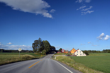 A typical Norwegian road in the countryside.  Ostfold Region, Norway