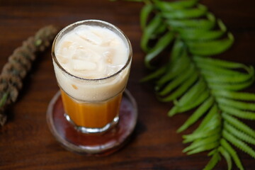Iced coffee with milk, chocolate syrup and meringues. Isolated Focus