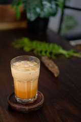 Iced coffee with milk, chocolate syrup and meringues. Isolated Focus