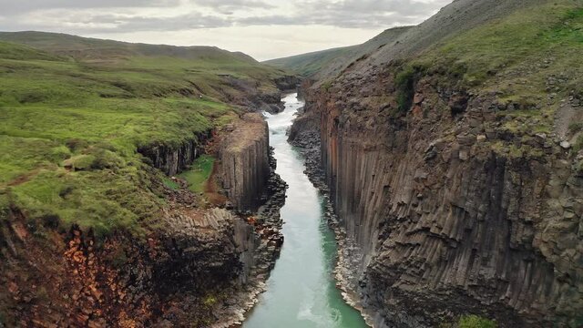 Stu&eth;lagil canyon in Iceland. Unique volcanic basalt column formation in J&ouml;kuldalur valley, Eastern Iceland. Tourist destination. Aerial shot. 