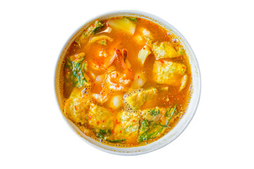 Acacia omelet with fresh shrimp in vegetable sour soup isolated on white background. Deep fried cha om leaves sour curry. Kang som cha om koong spicy of Asian traditional style. Thai food. Top view