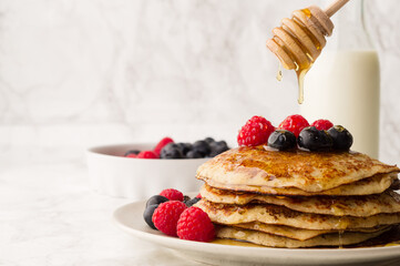 Healthy summer breakfast,homemade classic american pancakes with fresh berry