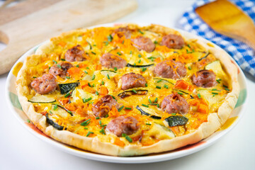 French quiche with vegetables and sausage
