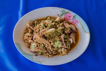 Spicy Minced Pork Salad on blue background
