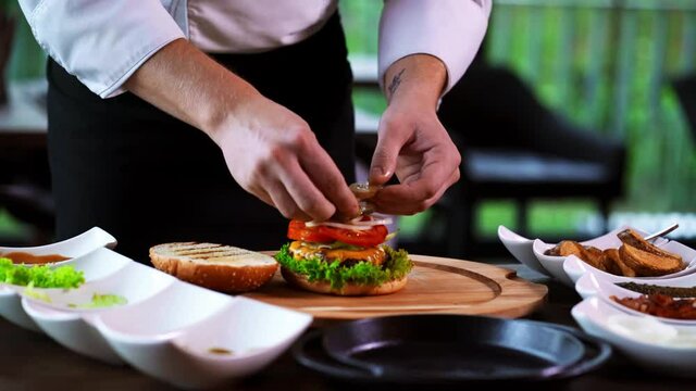 Making a Burger Step by Step Process Restaurant Chef Putting Ingredients