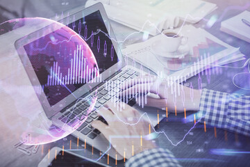 Double exposure of forex graph with man working on computer on background. Concept of market analysis.