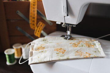 detail of a homemade cotton protective mask, close up on a sewing machine