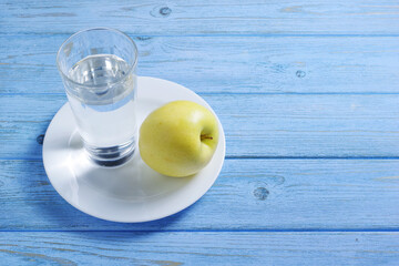 Drinking water and green apple