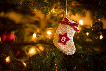 Traditional Advent Calendar Stocking with the date of the eighth of December hanging on a...