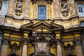 Fototapeta na wymiar Close up on the facade of Santa Maria Maddalena Church in Rome
