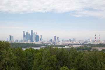 panoramic view of a business district with modern skyscrapers in summer on a sunny day