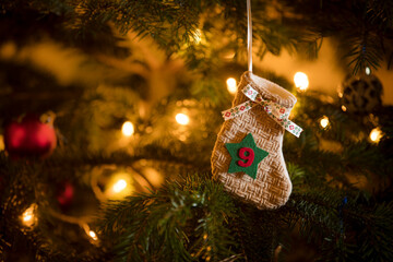 Traditional Advent Calendar Stocking with the date of the ninth of December hanging on a...