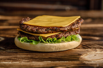 Homemade cheeseburger. Can be used for restaurant, cafe, food truck menu. Burger for ads. Burger for bigboard. Cheeseburger with 2 meat. Fast food. Burger for food post. Close up cheeseburger. 