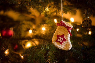 Traditional Advent Calendar Stocking with the date of the 20th of December hanging on a traditional...