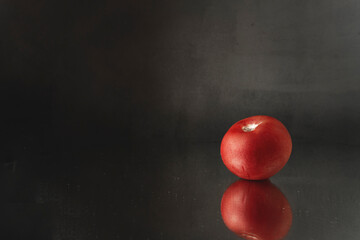 tomato on black background