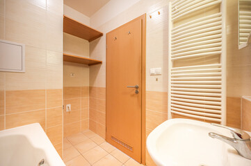 Fototapeta na wymiar Bathroom and toilet in an apartment for rent. Real estate photo.