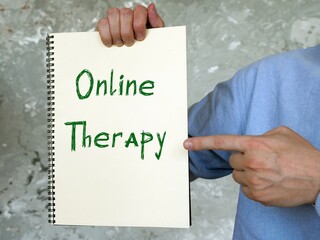 Motivation concept about Online Therapy with inscription on the piece of paper.