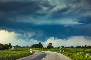 Severe supercell storm clouds with wall cloud and intense rain