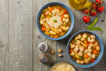 Minestrone soup with pasta and cheese or crostini.