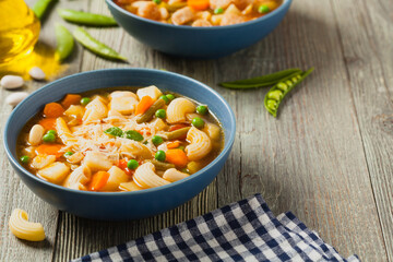 Minestrone soup with pasta and cheese.