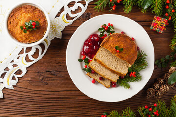 Small, baked patties in Christmas retro styling. Top view. Natural wooden background.