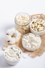 Vitamins and organic dietary supplements  to support human`s health and immunity on a white background.