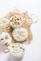 Vitamins and organic dietary supplements  to support human`s health and immunity on a white background.