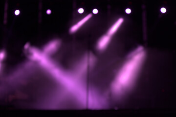 Defocused image of the lights of a modern music concert