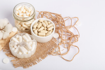 Vitamins and organic dietary supplements  to support human`s health and immunity on a white background.