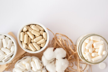 Vitamins and organic dietary supplements  to support human`s health and immunity on a white background.