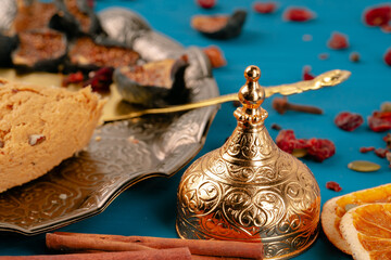 Turkish delight dessert on traditional tableware on dark blue table