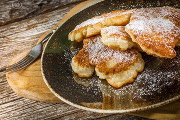 Homemade pancakes on a wooden table.