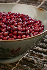 A Bowl Of Small Red Beans On The Branch Table Mat