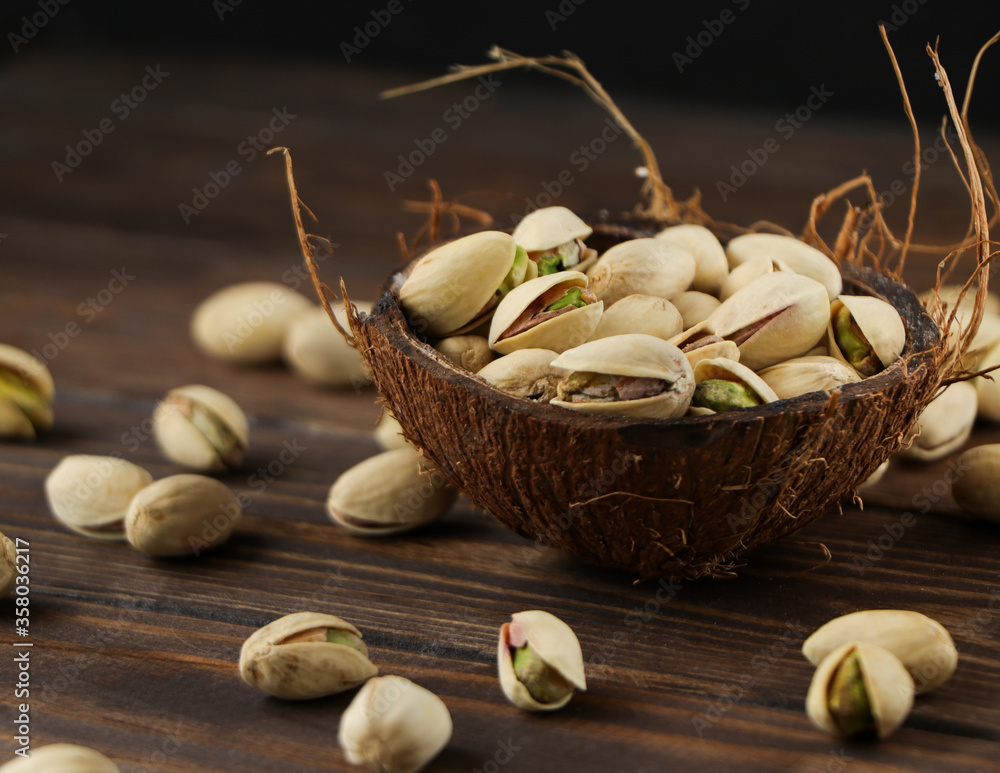 Wall mural Pistachios isolated closeup, healthy and tasty