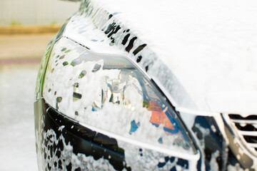 Manual car washing in car wash shop service.