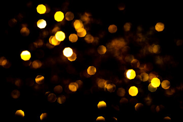 Bokeh lights on black . Beautiful Christmas background , New Year concept