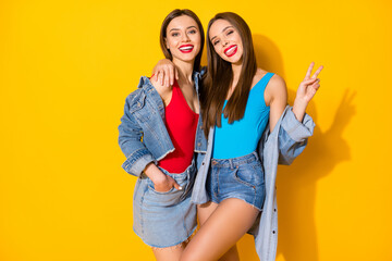 Portrait of positive cheerful fellows girls enjoy summertime weekend holiday make v-sign feel...
