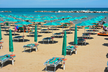beach with umbrellas and chairs