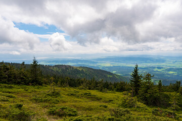 Obraz premium panoramic view of green valley with small village in slovakia 