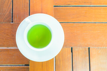 Top view of hot green tea on the table