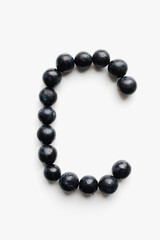 alphabet from berries on white background, letters from berries on a white background 