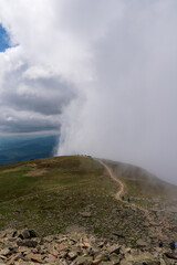 Mountain trail leading over ridge of fog, slovakia poland Babia gora