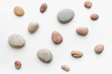 sea ​​stones on white background, background of stones, 
sea ​​stones, 