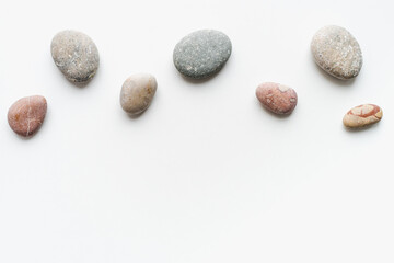 Fototapeta na wymiar sea ​​stones on white background, background of stones, sea ​​stones, 