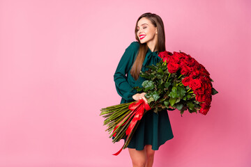 Photo of adorable charming chic lady hold large red long roses bouquet overjoyed boyfriend husband...