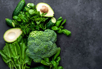 Set of raw healthy food for vegetarians on a stone background