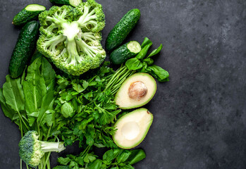 Set of raw healthy food for vegetarians on a stone background